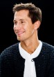 morten gamst pedersen in knitted cardigan looking left